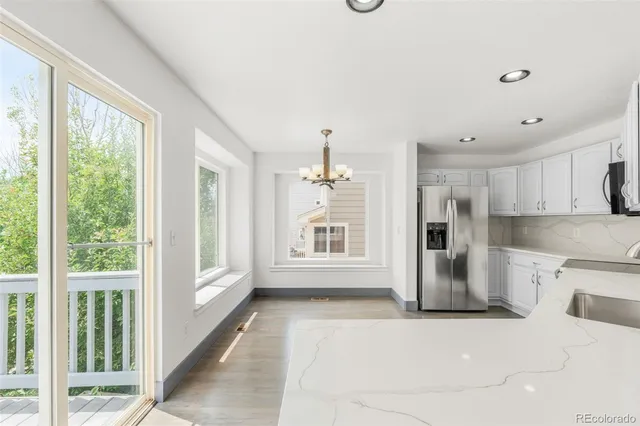 a view of a kitchen with a stove top oven