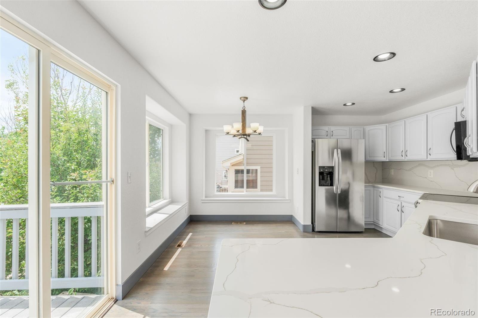 20412 East Chenango Place Aurora, CO 80015 - Photo 8 of 25 a view of a kitchen with a stove top oven