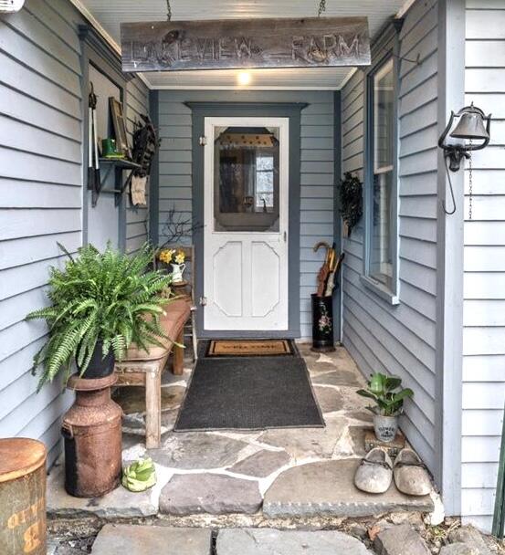 166 Alpine Lake Road Henryville, PA 18332 - Photo 7 of 52 a potted plant sitting in front of a door