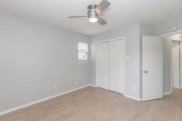 a view of a livingroom with a chandelier fan