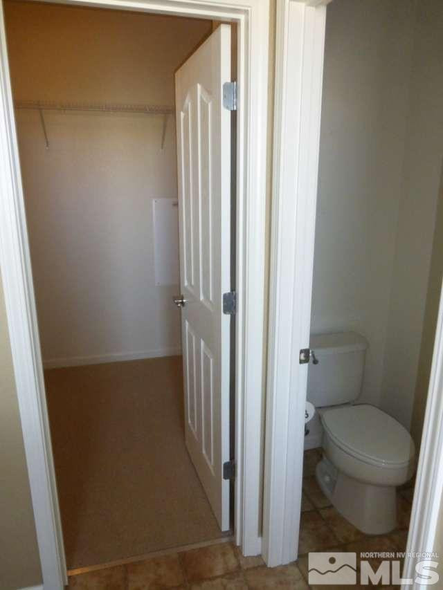 2471 Spring Flower Drive Reno, NV 89521 - Photo 12 of 20 a bathroom with a toilet and a shower