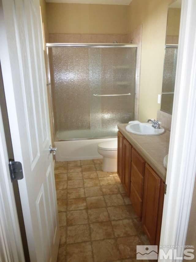 2471 Spring Flower Drive Reno, NV 89521 - Photo 16 of 20 a bathroom with a sink a toilet and shower