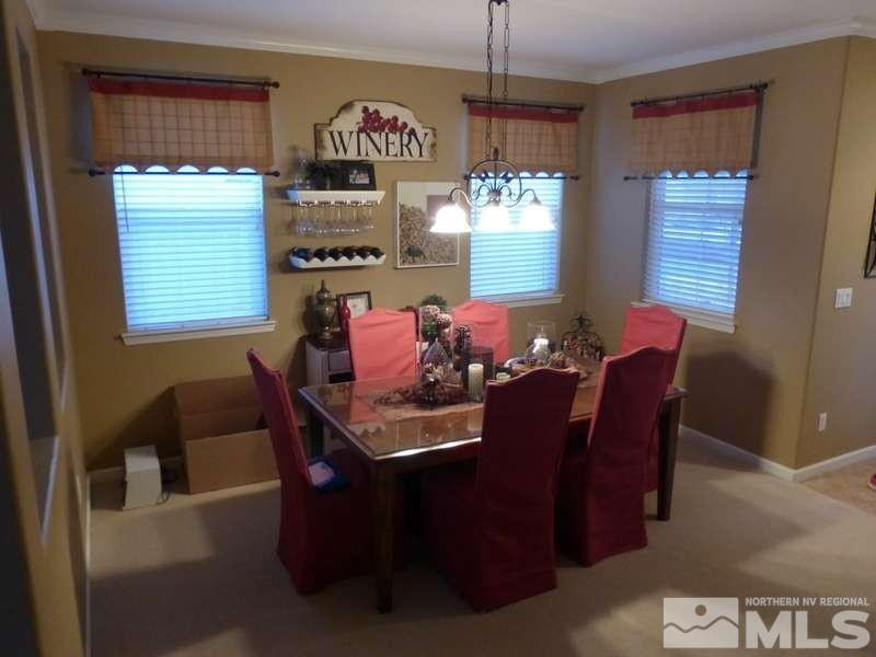 2471 Spring Flower Drive Reno, NV 89521 - Photo 3 of 20 a view of a dining room with furniture and window