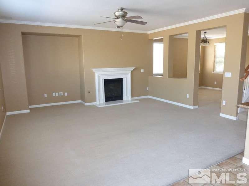 2471 Spring Flower Drive Reno, NV 89521 - Photo 7 of 20 a view of an empty room with a fireplace