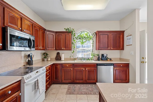 a kitchen with a sink stove and cabinets