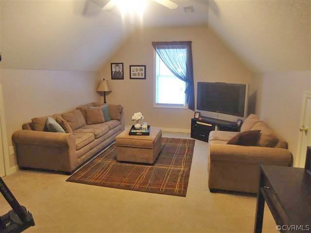 12619 Harrowgate Road Chester, VA 23831 - Photo 6 of 8 a living room with furniture and a flat screen tv