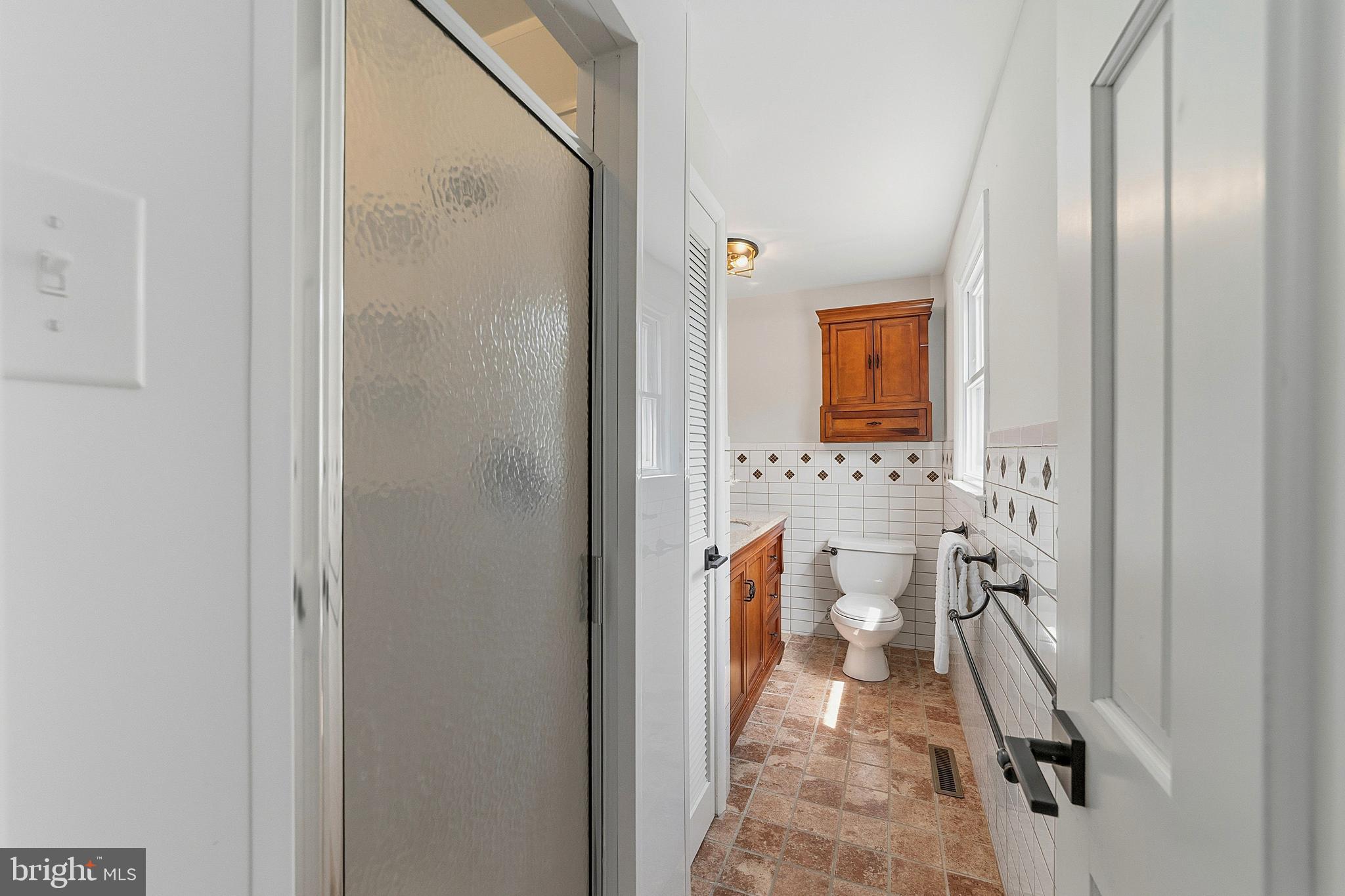 117 Harvest Road Cherry Hill, NJ 08002 - Photo 27 of 35 a bathroom with a toilet sink and a mirror