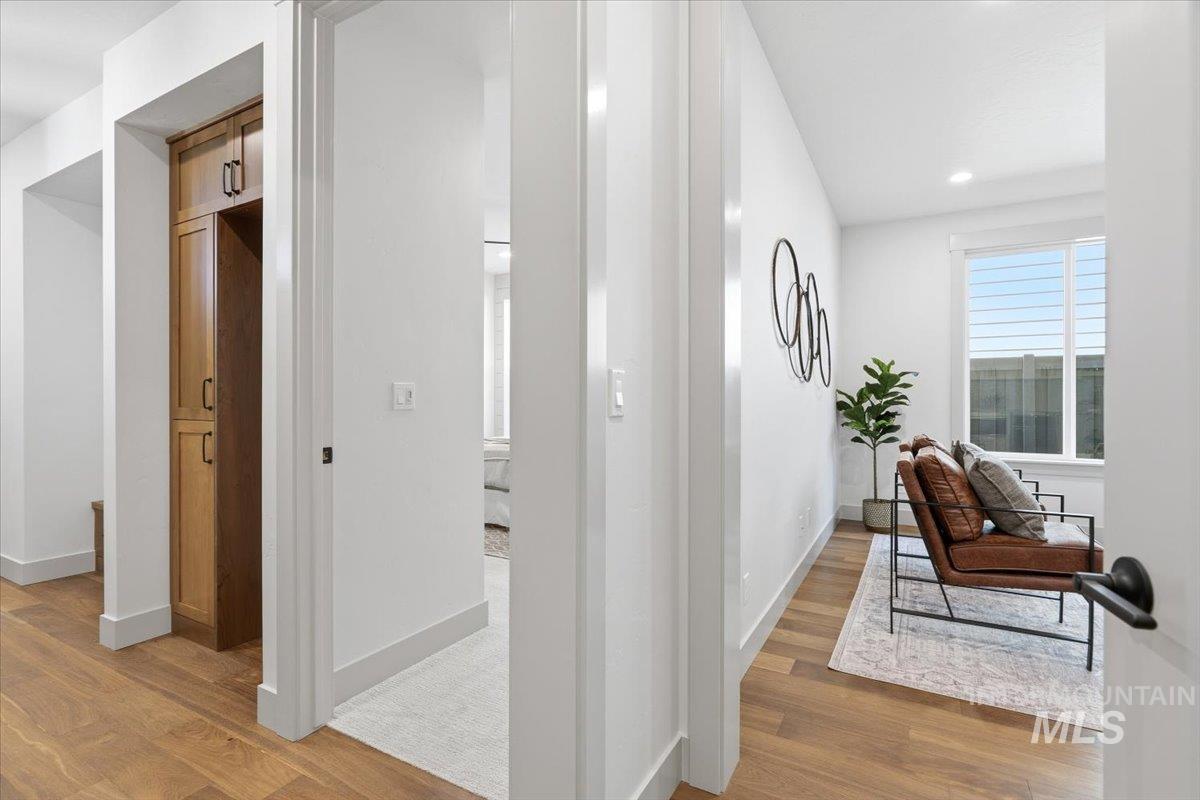 6762 South Messner Way Meridian, ID 83642 - Photo 21 of 35 Bright interior hallway with wood-finish flooring