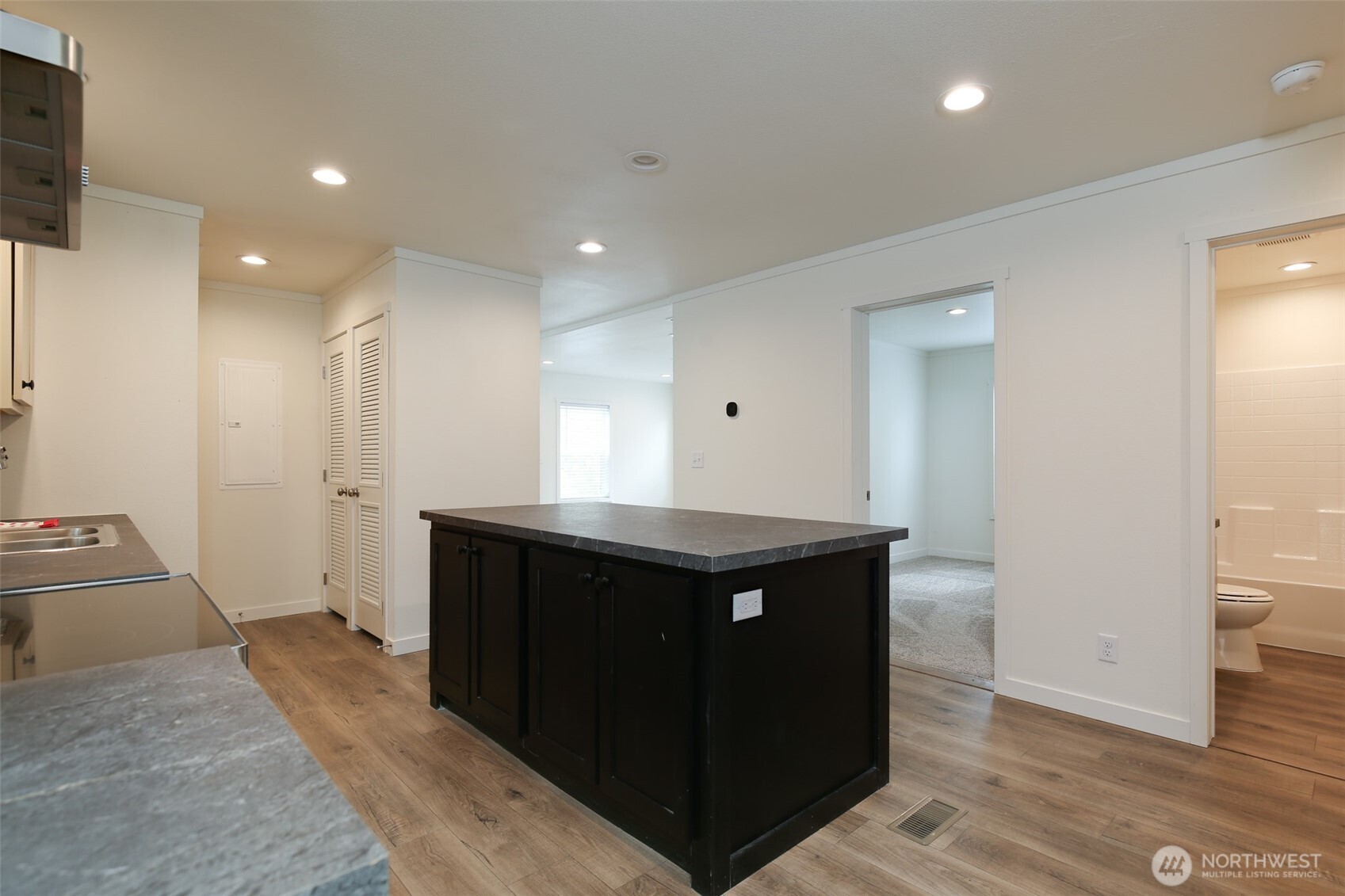464 Sycamore Road Coupeville, WA 98239 - Photo 11 of 30 a kitchen with stainless steel appliances granite countertop a refrigerator and a sink