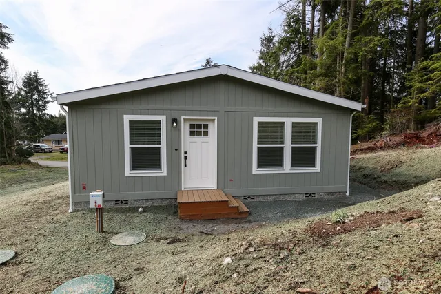 a backyard of a house with seating space