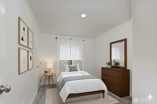 a bedroom with a bed and a dresser