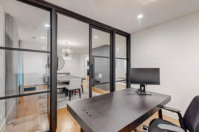 a view of a workspace with furniture