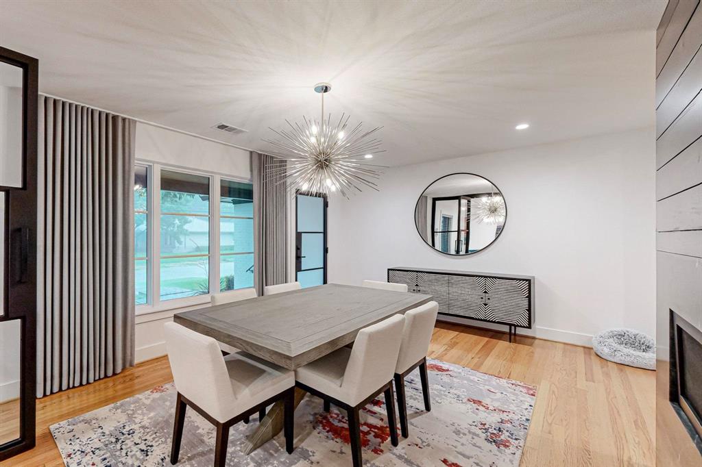 4423 Springside Lane Dallas, TX 75214 - Photo 14 of 40 a view of a dining room with furniture window and wooden floor
