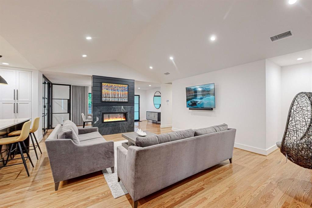 4423 Springside Lane Dallas, TX 75214 - Photo 18 of 40 a living room with furniture and wooden floor
