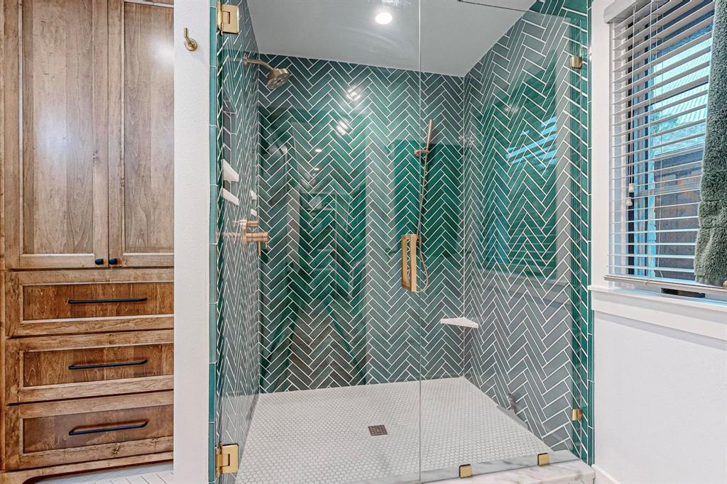 4423 Springside Lane Dallas, TX 75214 - Photo 23 of 40 a bathroom with a shower and a sink