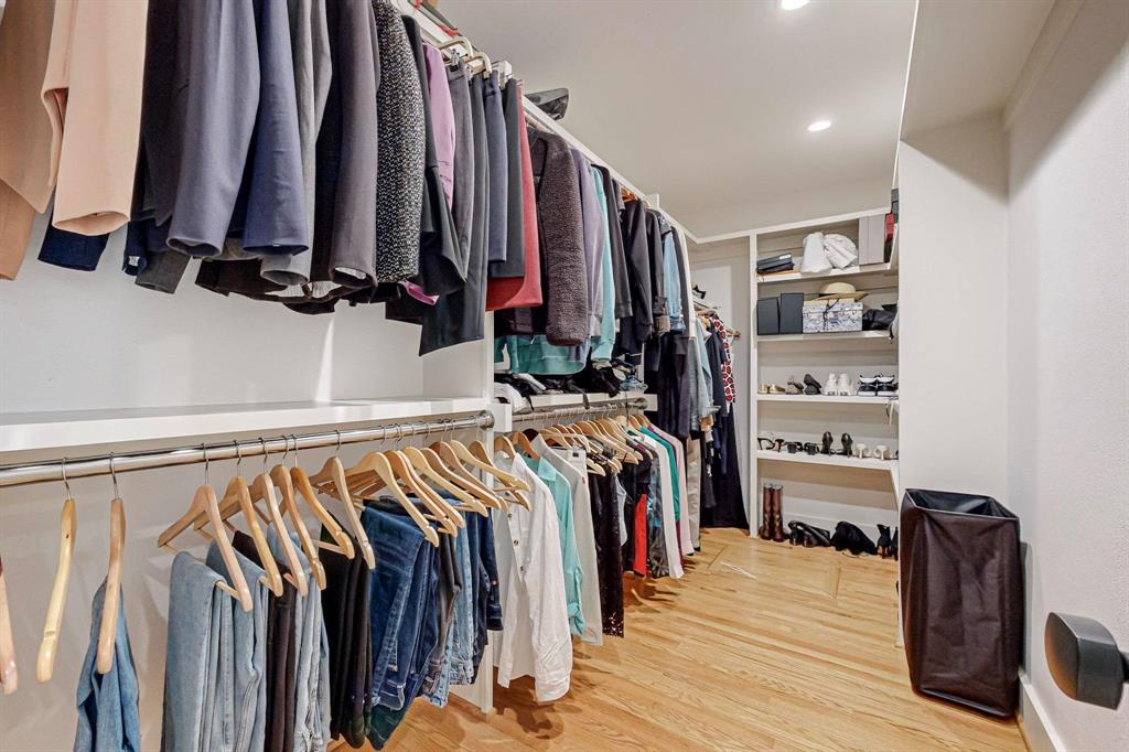 4423 Springside Lane Dallas, TX 75214 - Photo 25 of 40 a view of walk in closet with clothes and shoes