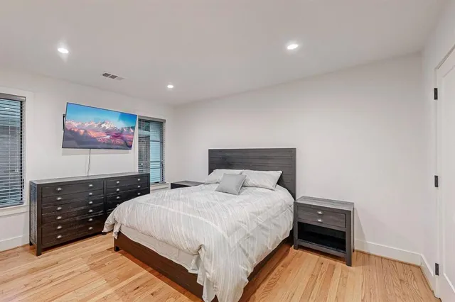 a bedroom with a bed and a dresser