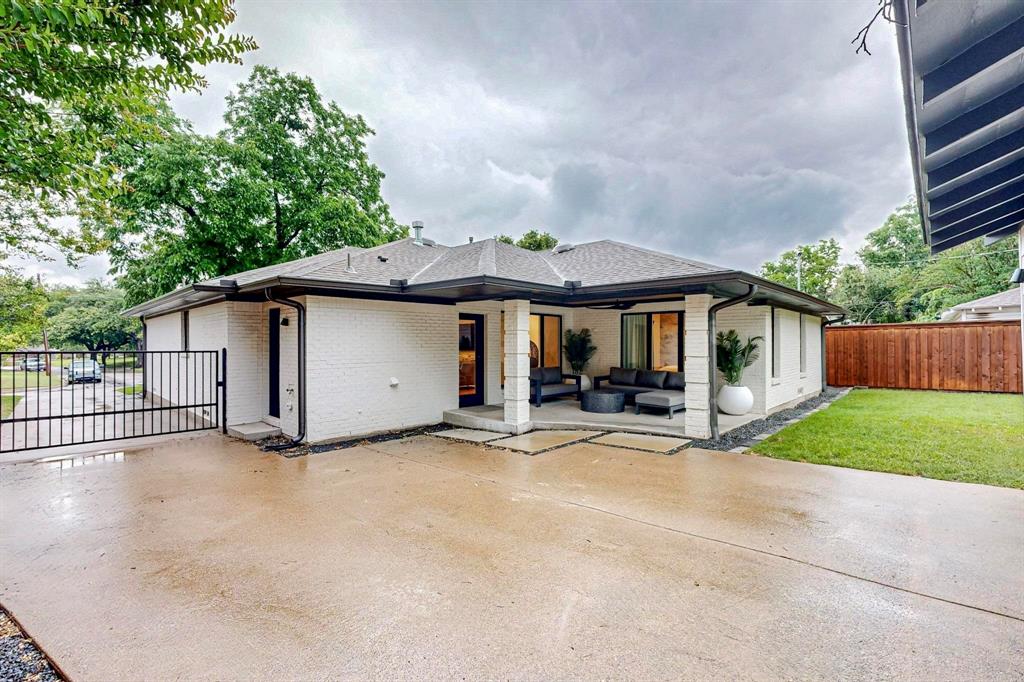4423 Springside Lane Dallas, TX 75214 - Photo 35 of 40 a view of a house with wooden fence and large trees