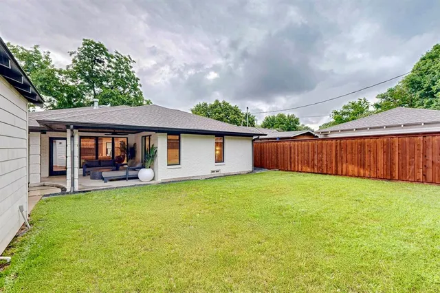 a view of a house with a yard porch and sitting area