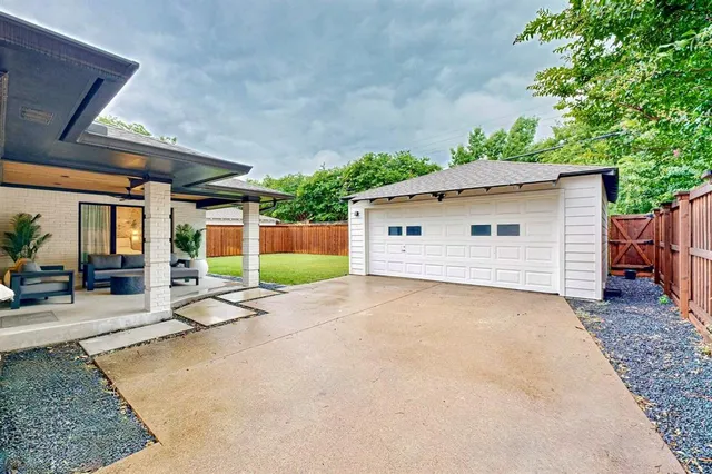 a view of a backyard with a patio