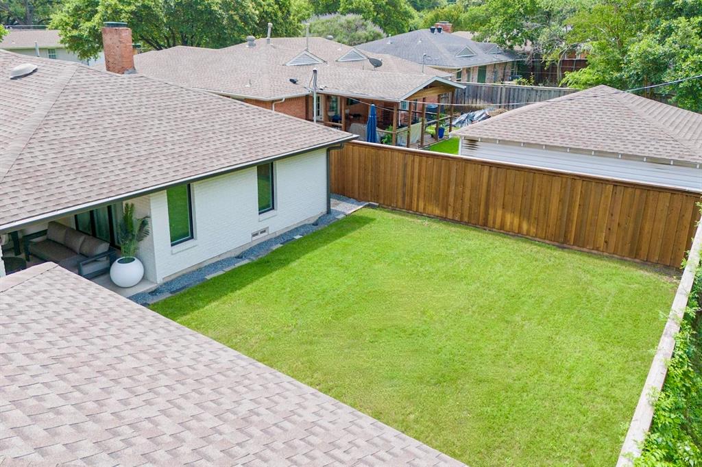 4423 Springside Lane Dallas, TX 75214 - Photo 6 of 40 a view of a house with a yard plants and large tree