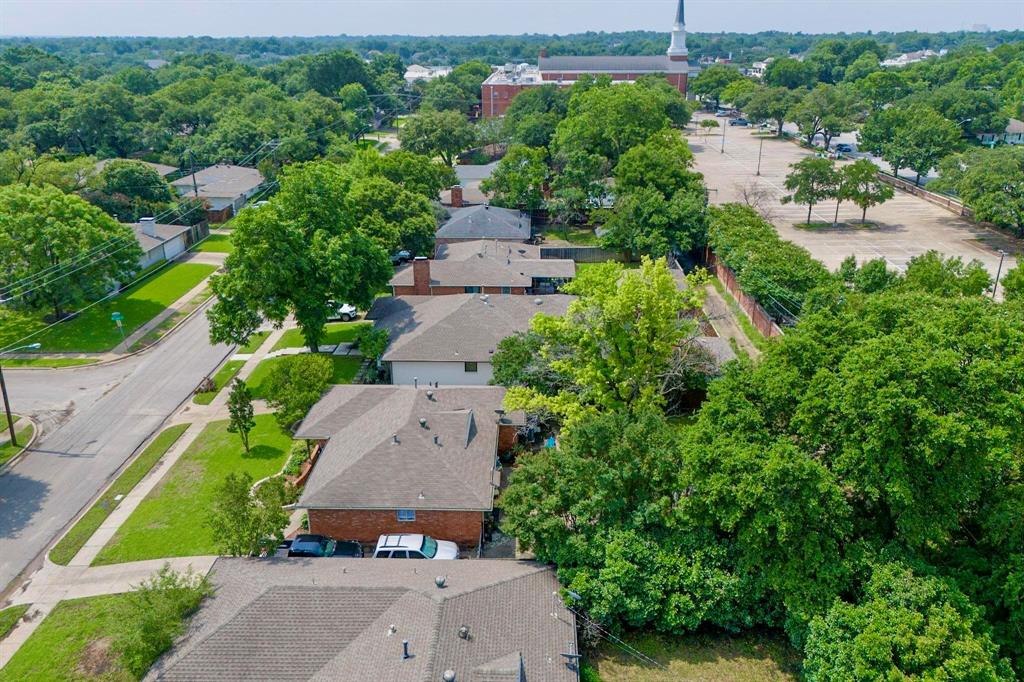 4423 Springside Lane Dallas, TX 75214 - Photo 7 of 40 an aerial view of a house with a yard and lake view