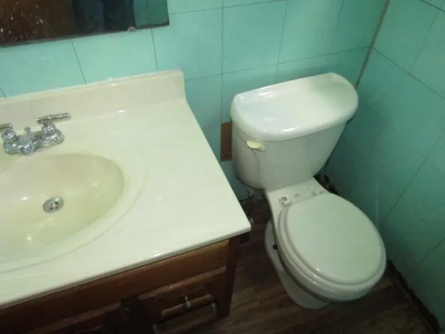 a bathroom with a toilet and a sink