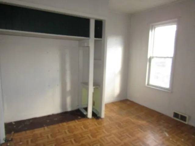 a view of an empty room and a window