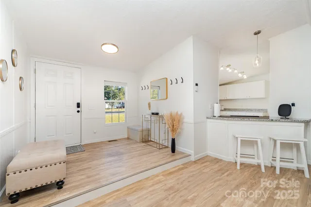 a spacious bedroom with a bed and a desk