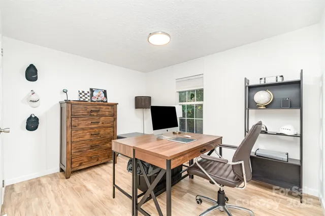 a view of a workspace with furniture