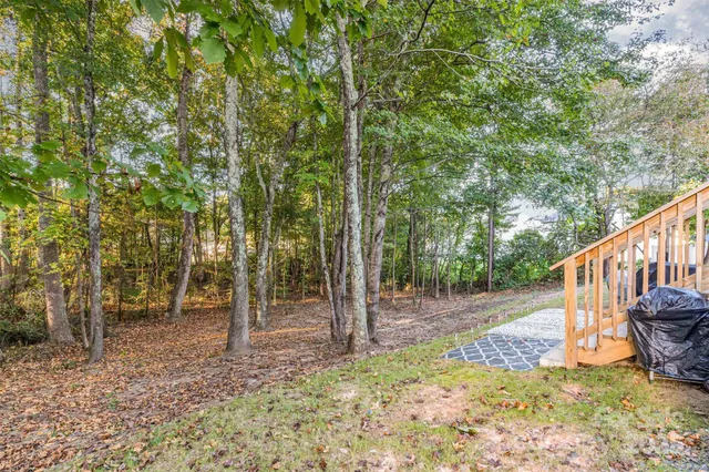 a view of a wooden deck with a backyard