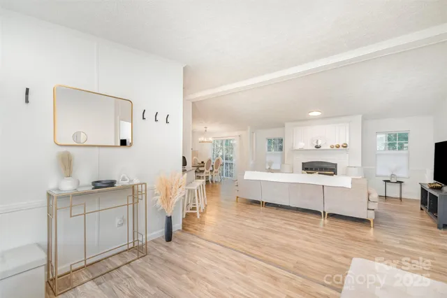 a large white kitchen with a large window