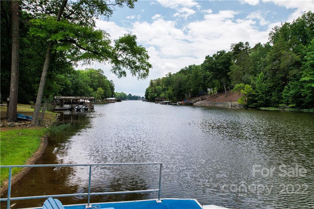 140 Beaver Dam Road Badin Lake, NC 28127 - Photo 3 of 40 a view of a lake with outdoor space