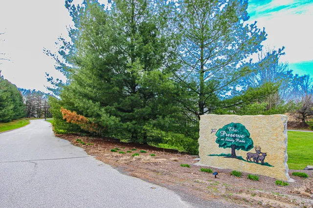 a view of a street in front of a house