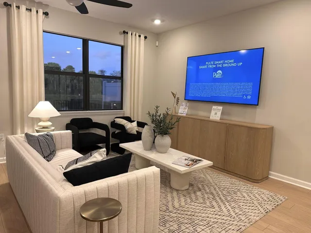 a bathroom with a toilet a sink and a large mirror