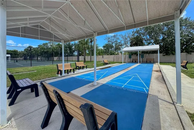 a view of a backyard with sitting area and furniture