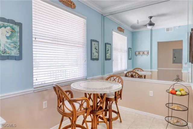 a view of a dining room with furniture and window