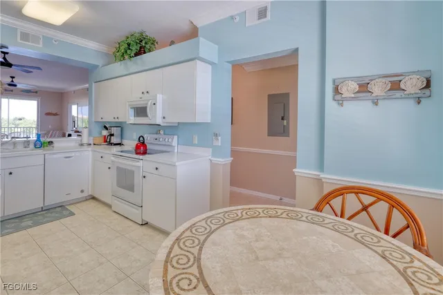 a kitchen with a sink a stove and cabinets
