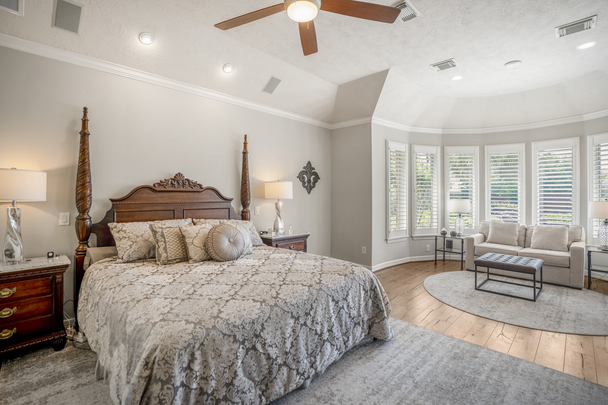 9707 Blue Cruls Way Spring, TX 77379 - Photo 27 of 50 a bedroom with a large bed and a chandelier