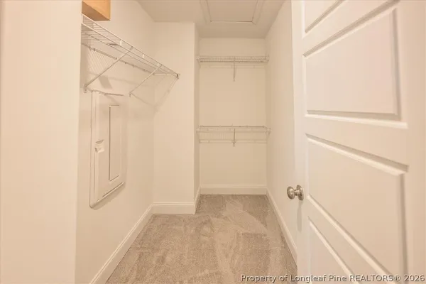a bathroom with a granite countertop sink a mirror and vanity