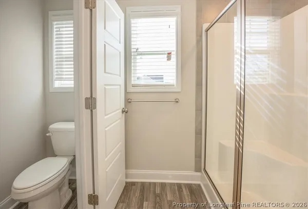 a bathroom with bathtub and window