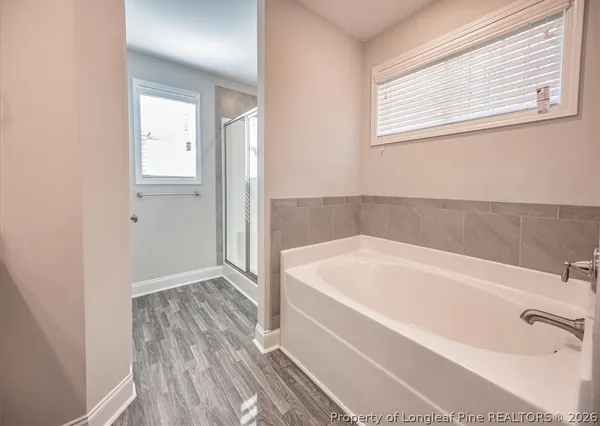 an empty room with a empty space and windows