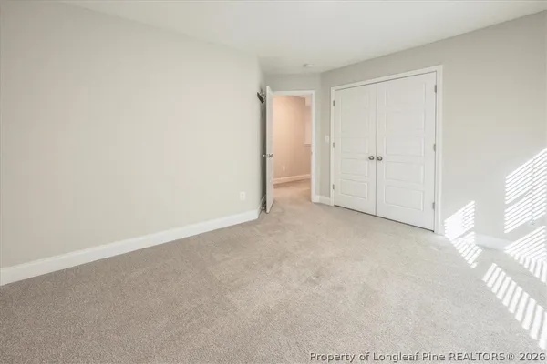 a bathroom with a granite countertop tub shower and sink
