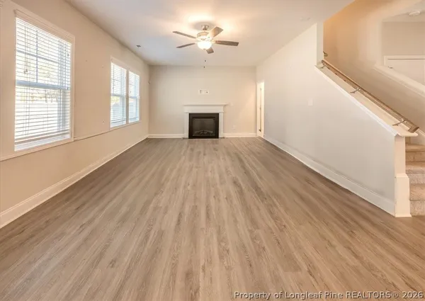 a view of a kitchen with wooden floor