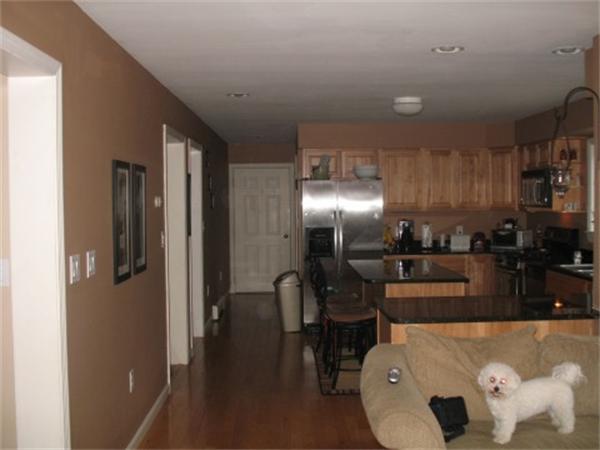 688 Marys Pond Road Rochester, MA 02576 - Photo 5 of 15 a kitchen with stainless steel appliances kitchen island granite countertop a refrigerator a stove and a sink with wooden floor
