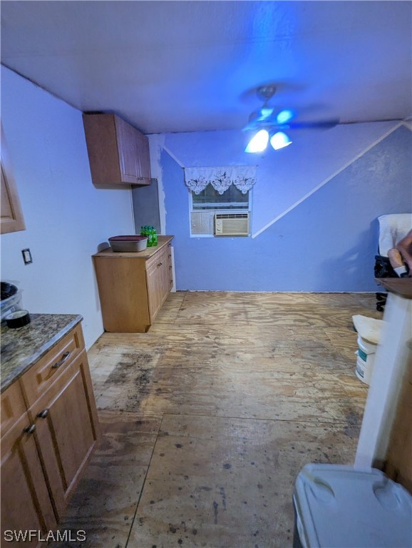 18261 Ace Road North Fort Myers, FL 33917 - Photo 6 of 20 a kitchen with granite countertop a sink a stove top oven and cabinetry