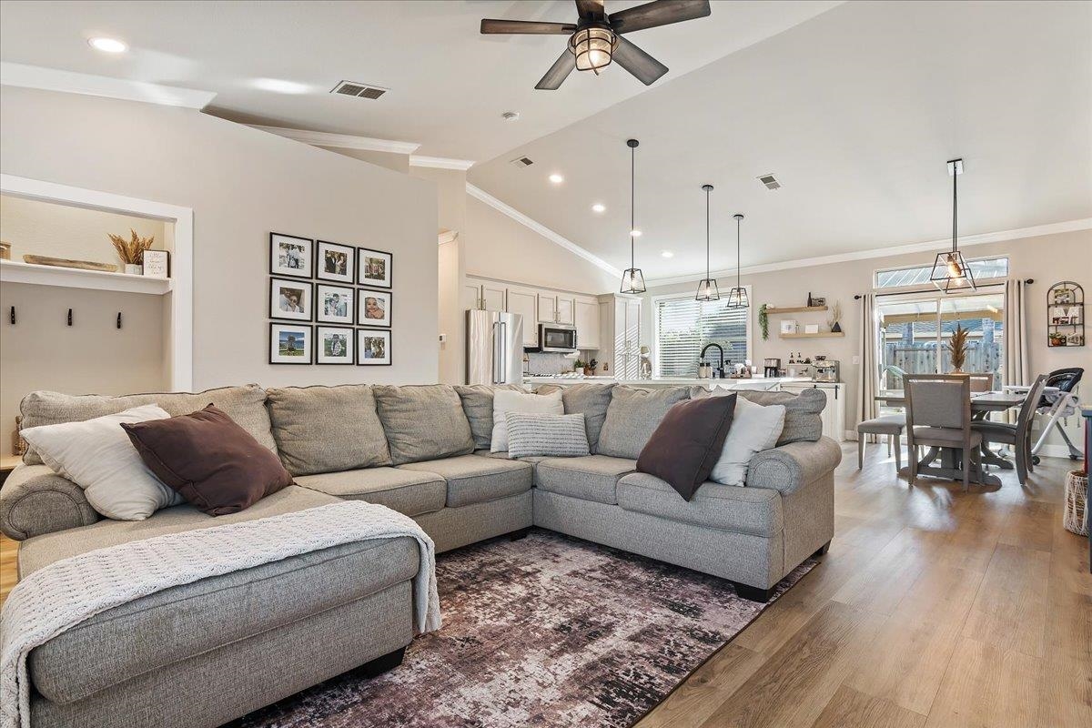 1105 Deerpark Road Oakley, CA 94561 - Photo 6 of 25 Living area with vaulted ceiling, wood finished floors, ceiling fan, crown molding, and recessed lighting