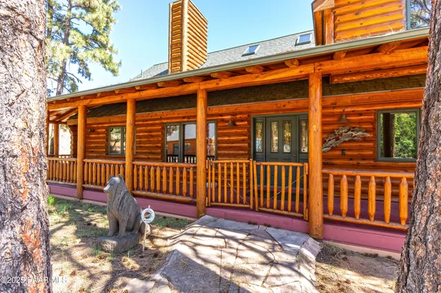 a view of a livingroom with wooden floor and a fireplace