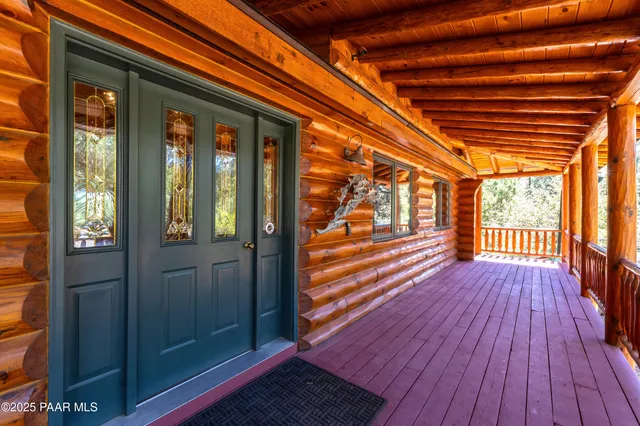 a view of a room with wooden floors