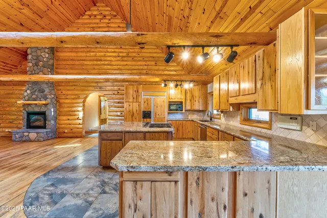 a kitchen with a stove and cabinets